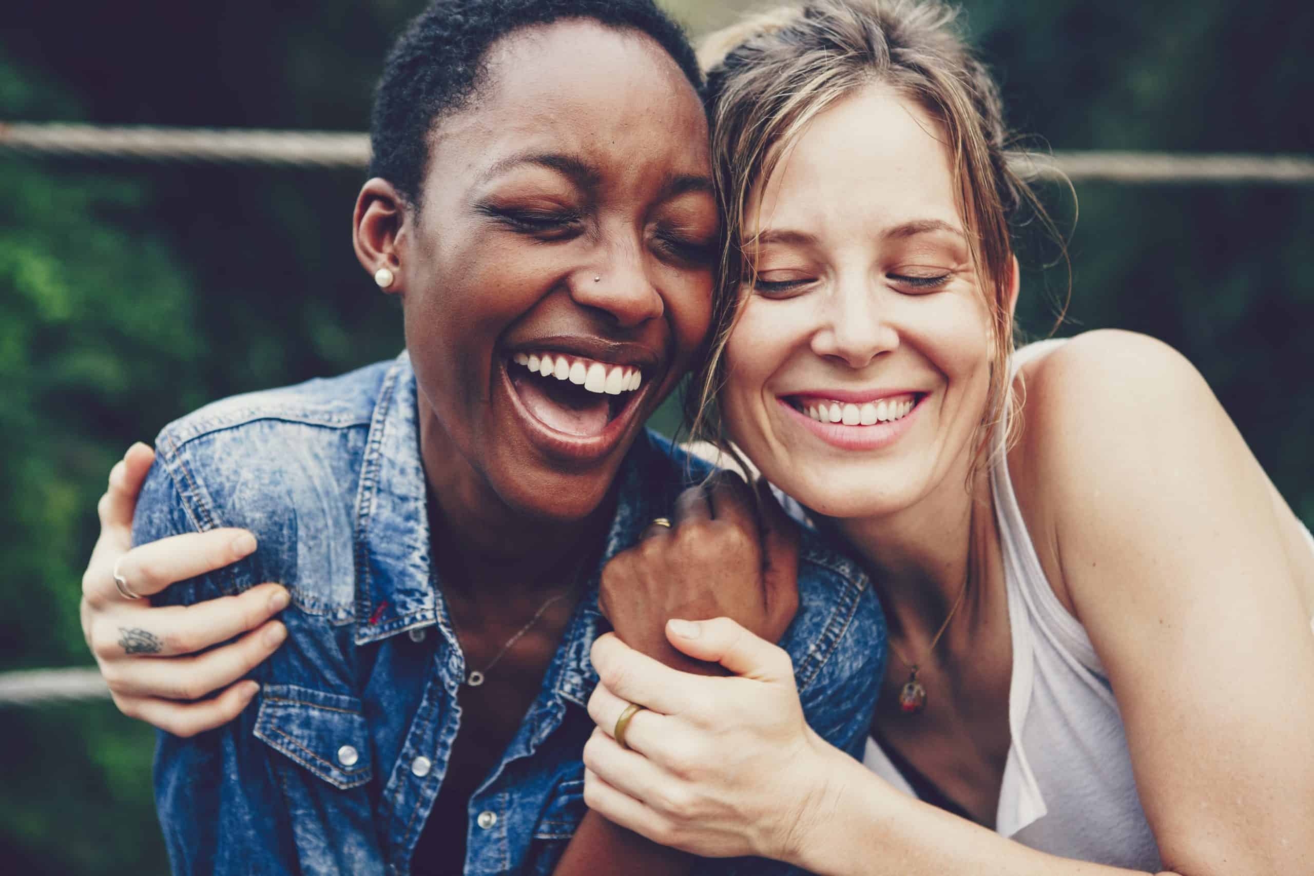 happy friends holding each other scaled Smile Dentist Toronto