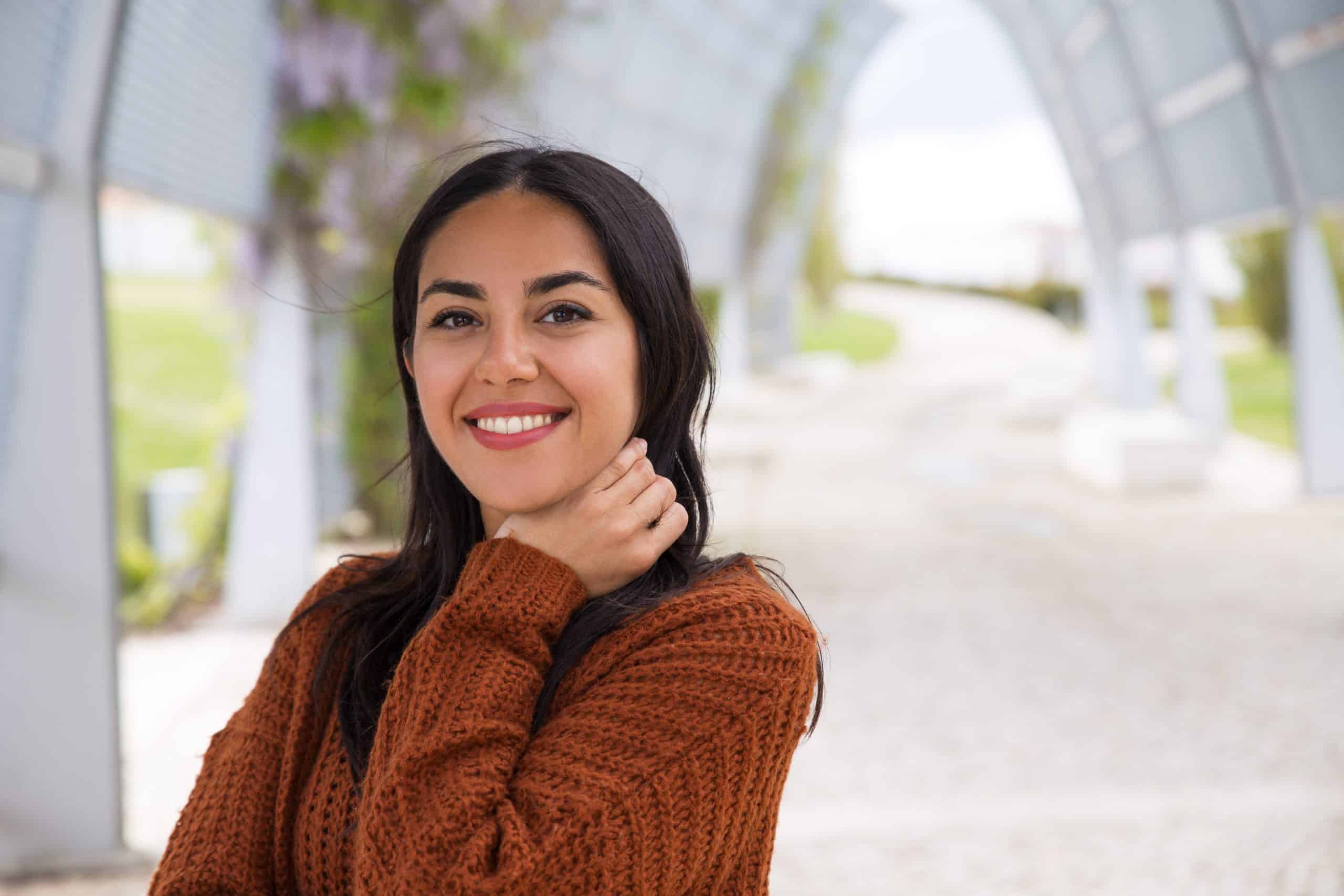 portrait happy excited asian girl adjusting hair scaled Smile Dentist Toronto
